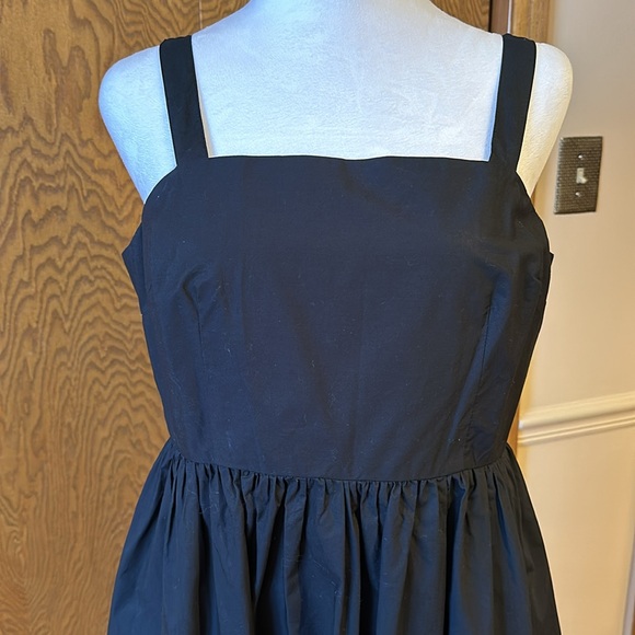 A New Day black dress size medium with a tan Universal Thread cross body purse. - Picture 2 of 16